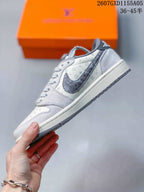 Jordan 1 Low Sneakers in White and Gray with Monogram Print