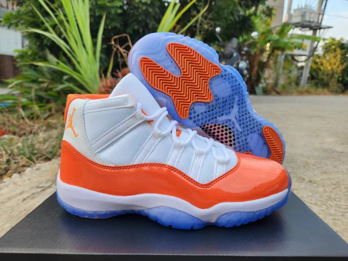 Jordan 11 White and Orange High-Top Sneakers