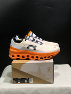 On Cloudmonster Running Shoes in Yellow Tan and Orange