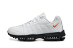 Nike Air Max White and Black Sneakers with Orange Swoosh