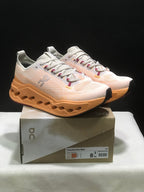 On Cloudsurfer Max Running Shoes in Pearl and Tangerine