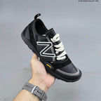 New Balance MT10O6NW Low-Profile Sneakers in Black