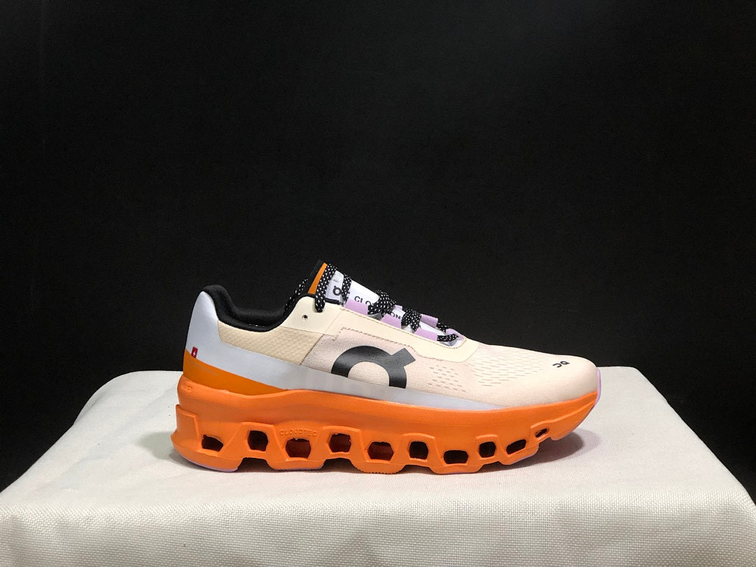 On Cloudmonster Running Shoes in Yellow Tan and Orange