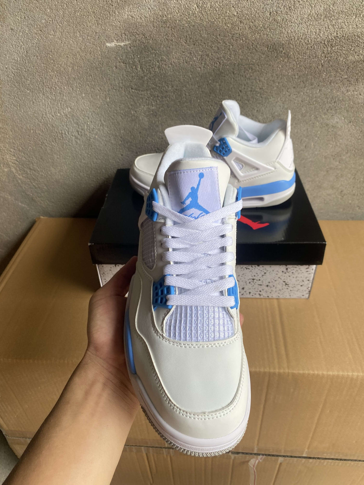 Air Jordan 4 White and Blue Sneakers
