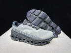 On Cloudmonster Running Shoes in Eclipse and Magnet