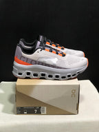 On Cloudmonster Sneakers in Foggy White and Orange