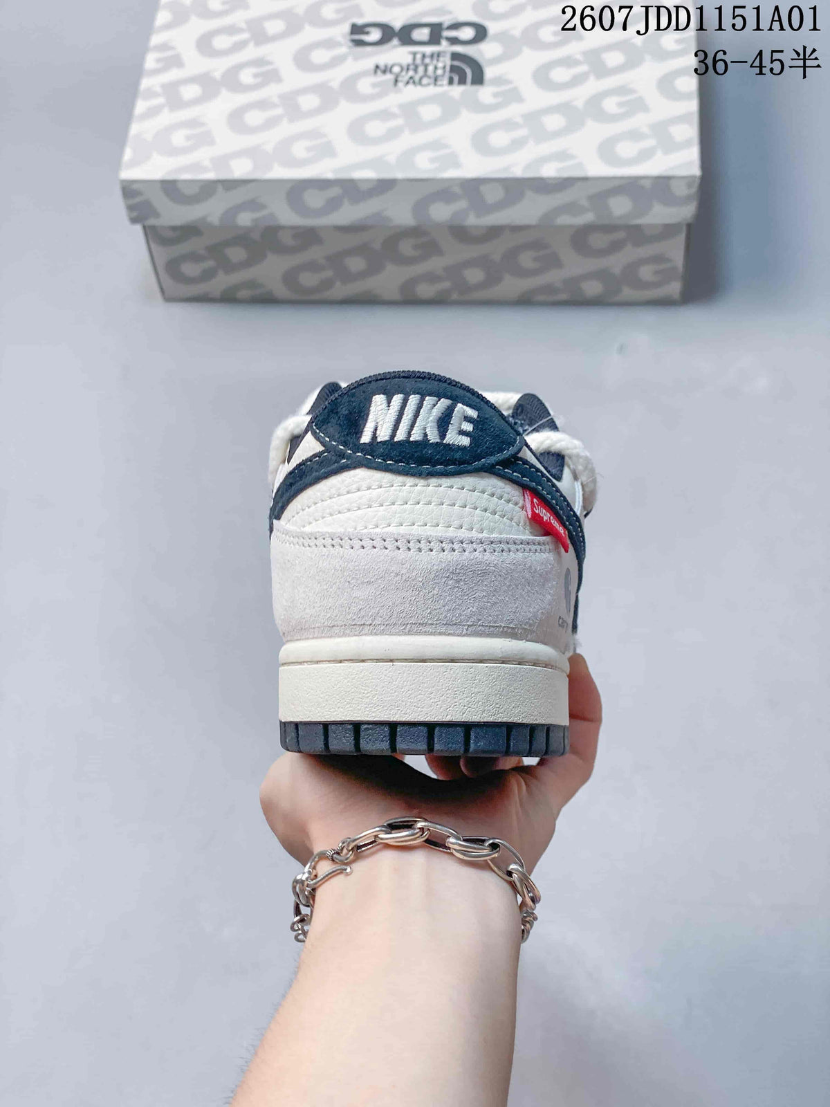 Nike SB Dunk Low x Carhartt White and Navy Sneakers