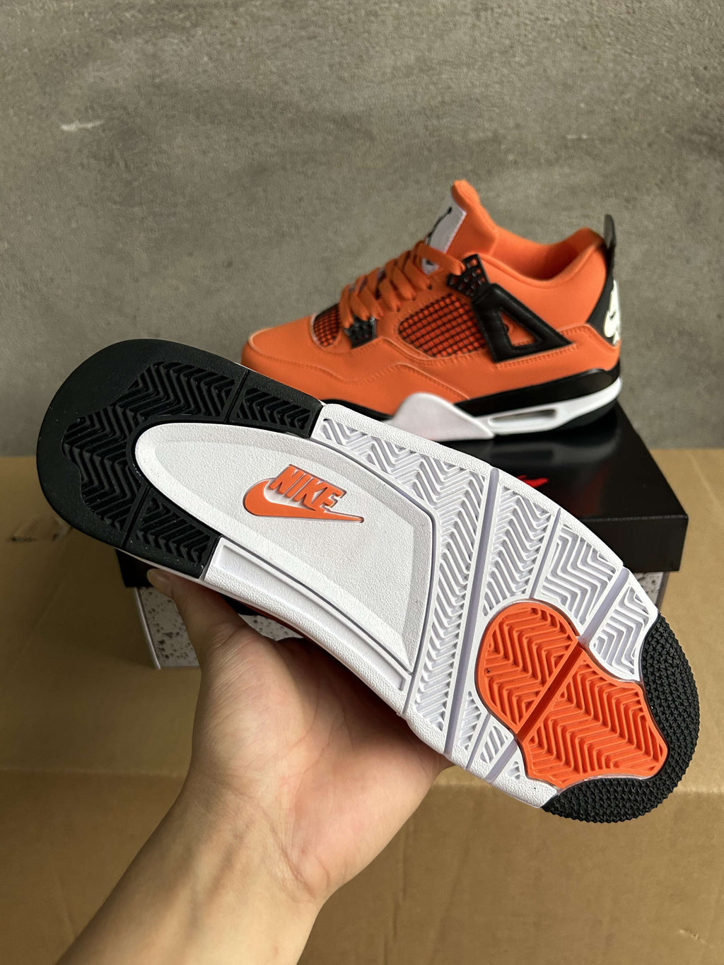 Jordan Air Jordan 4 Orange and Black Sneakers