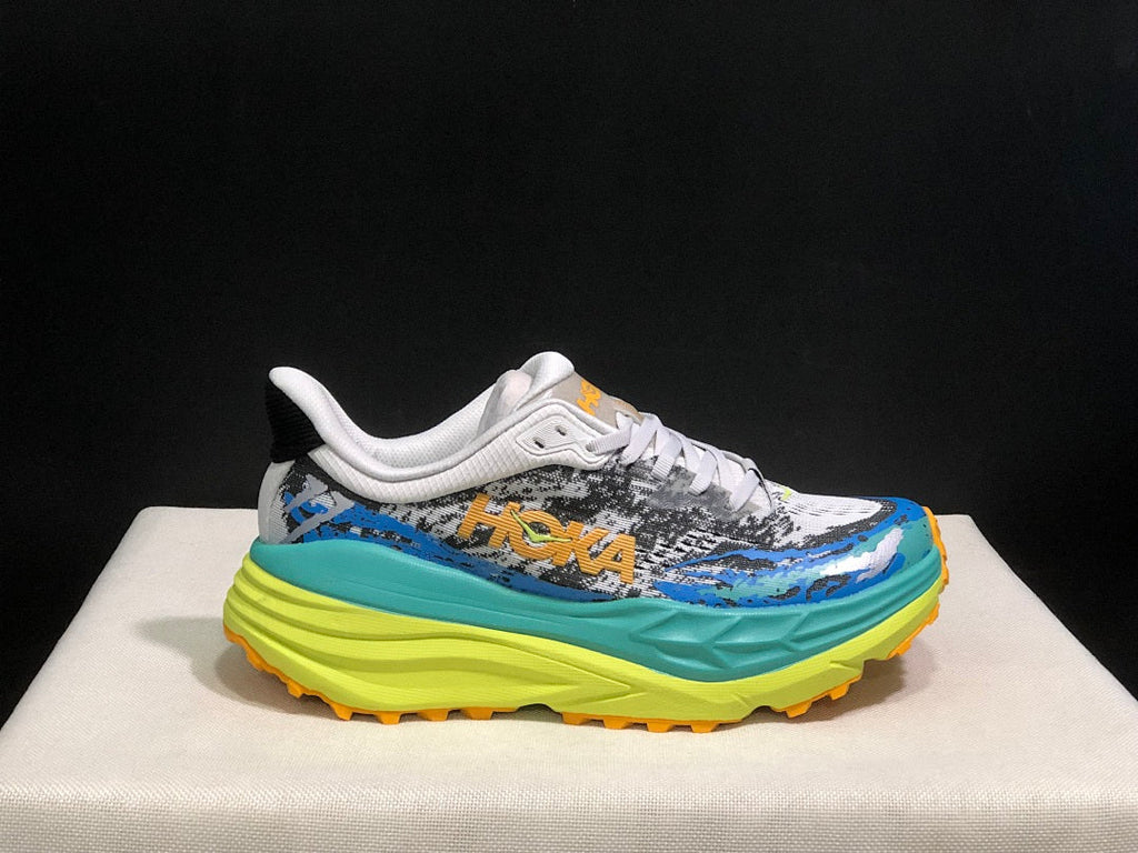 HOKA Stinson 7 Trail Sneakers in Blue and Lime