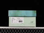 New Balance U9060JG1 Sneakers in Sage and Pink