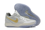 Nike Kyrie Low Basketball Shoes in Gray and Gold