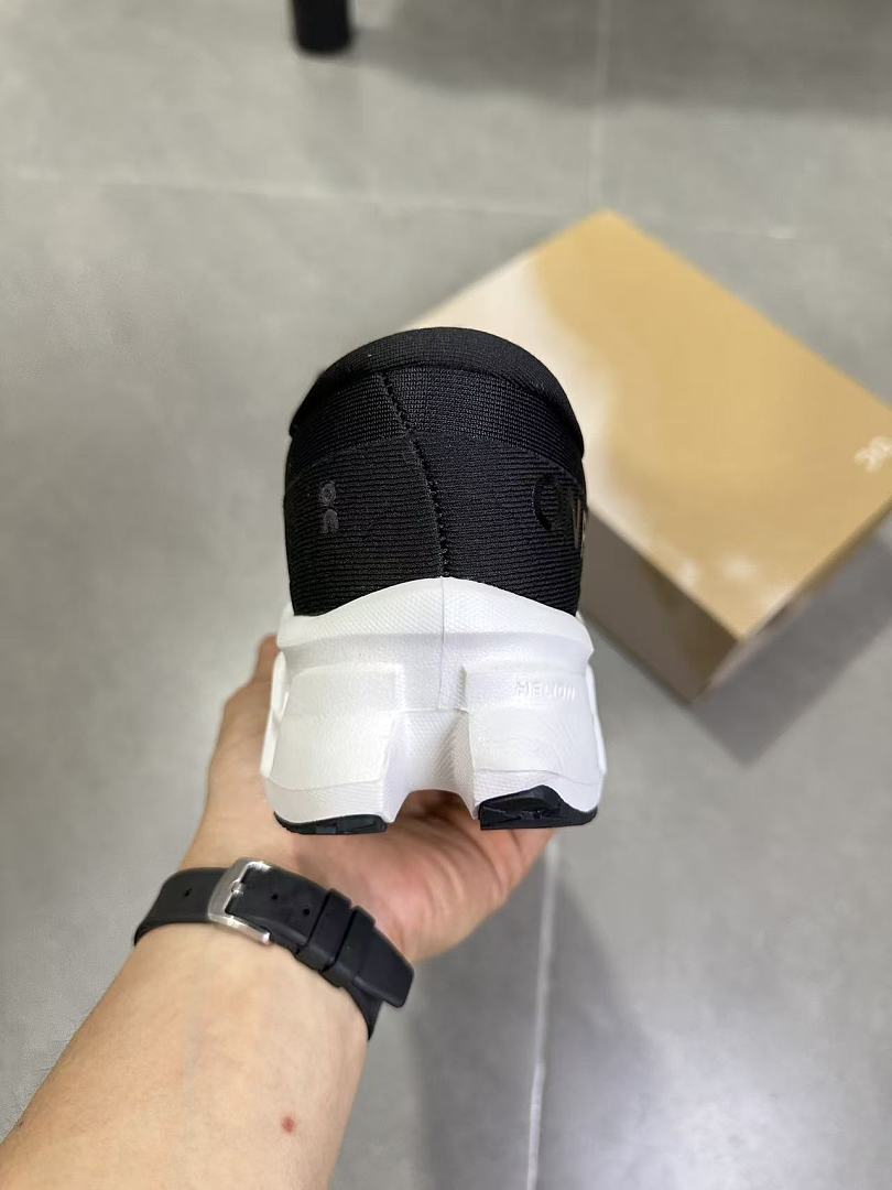 On Running Black and White Road Running Sneakers
