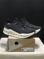 On Cloudsurfer Max Black and White Running Sneakers