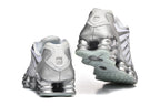 Nike Shox TL Sneakers in White and Metallic Silver