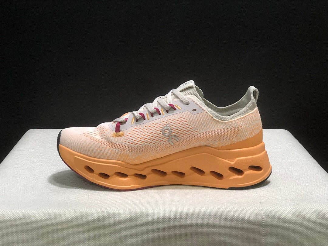On Cloudsurfer Max Running Shoes in Pearl and Tangerine