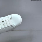 Alexander McQueen Oversized White Low-Top Sneakers with Black Heel