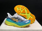 HOKA Stinson 7 Trail Sneakers in Blue and Lime