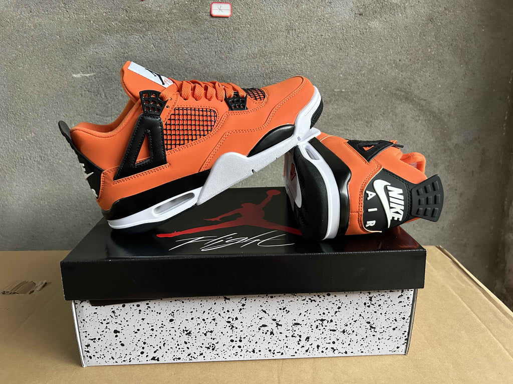 Jordan Air Jordan 4 Orange and Black Sneakers