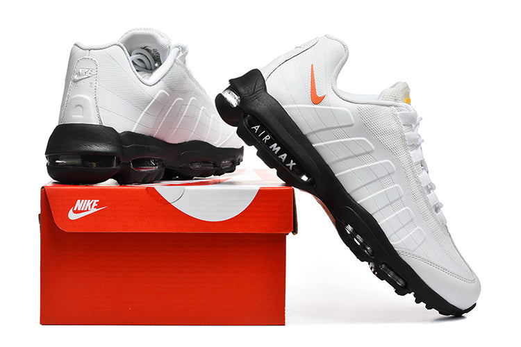 Nike Air Max White and Black Sneakers with Orange Swoosh