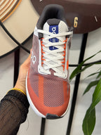 On Cloudsurfer Running Shoes in Rust and White