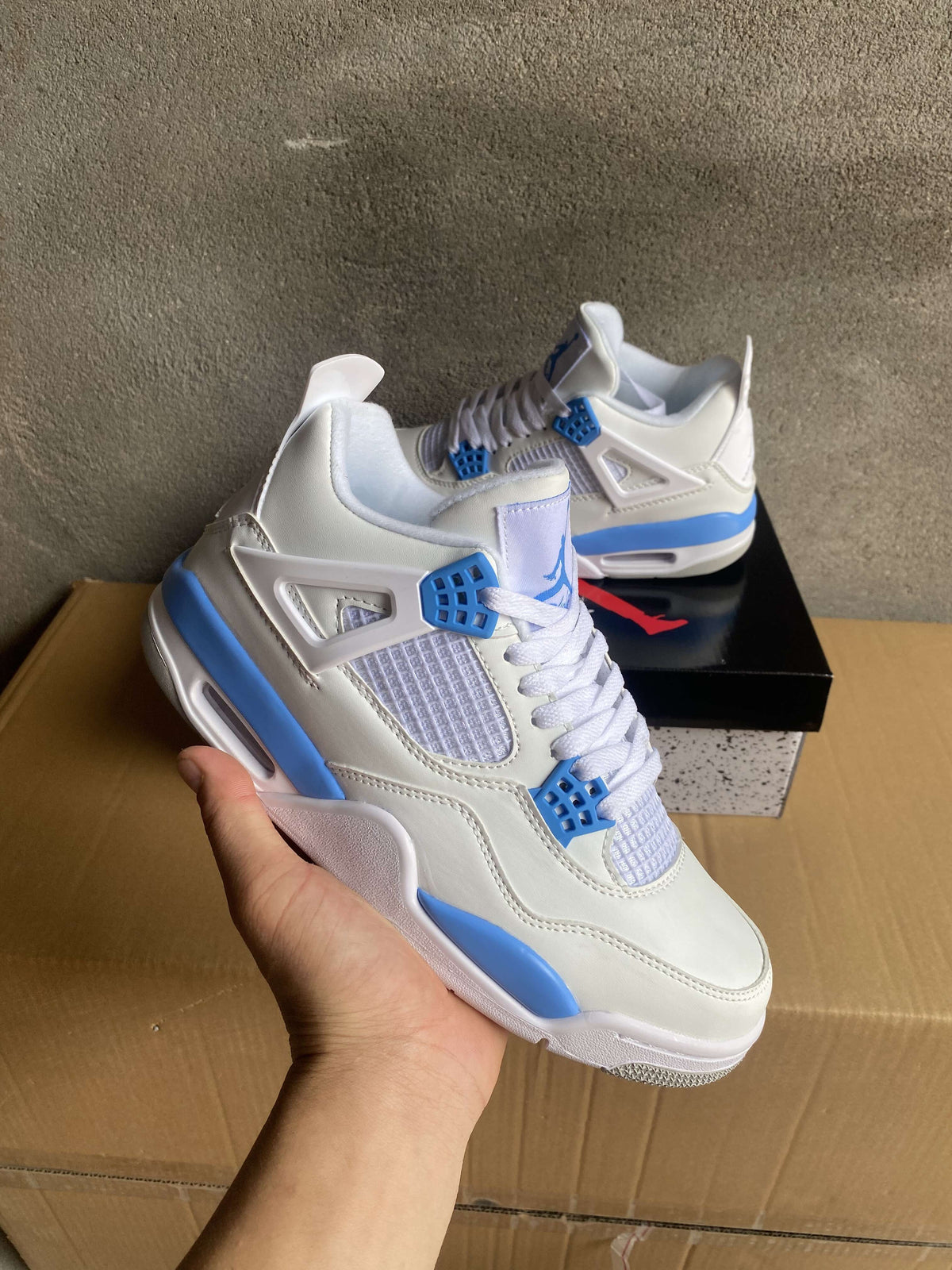 Air Jordan 4 White and Blue Sneakers
