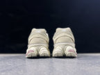 New Balance 9060ZGC Sneakers in Cream and Mauve